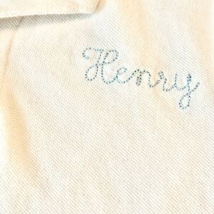 White golf shirt w/Henry embroidery. Black SS Pokémon Henry 6 graphic